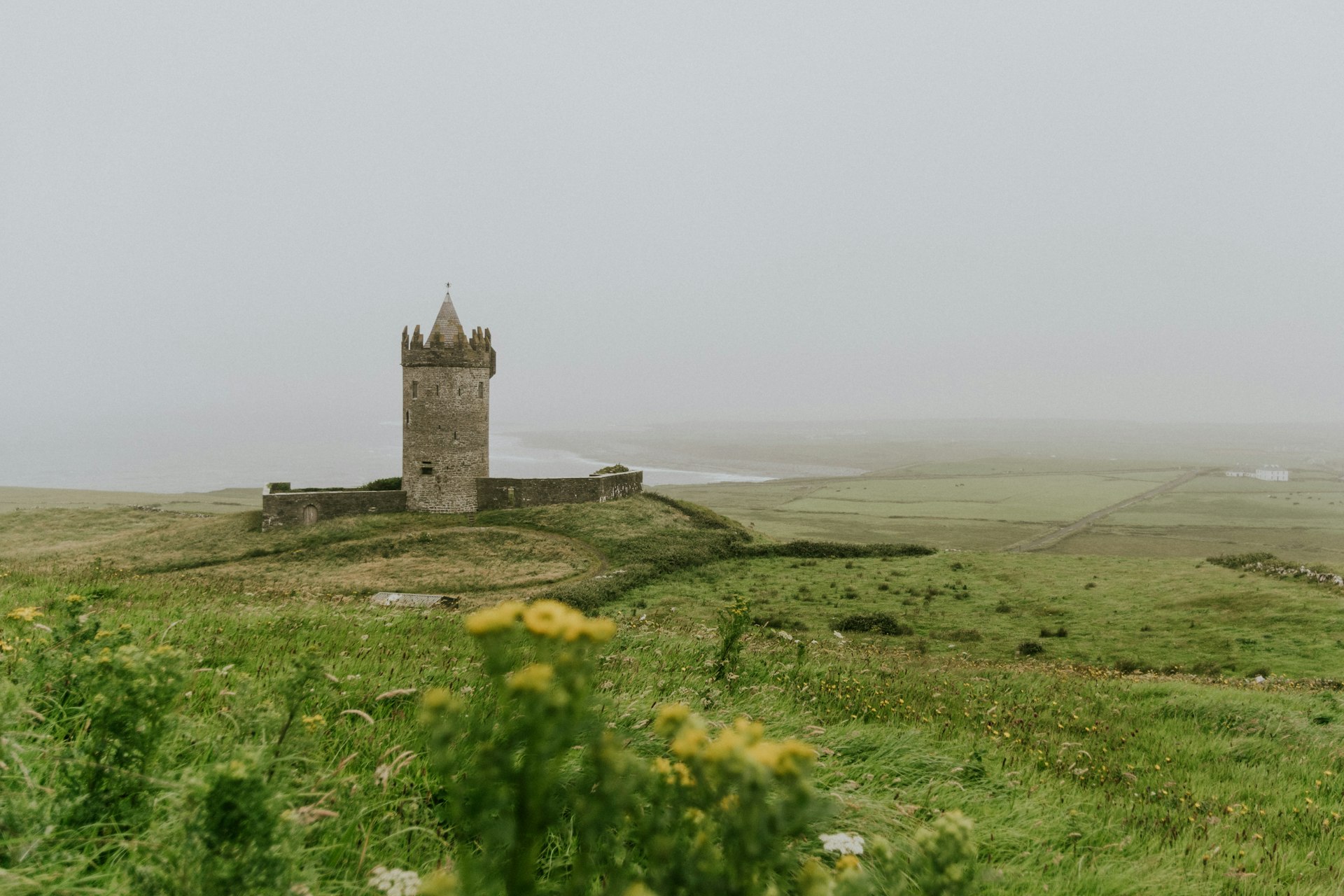 Doonagore Castle overlooking Irish coast