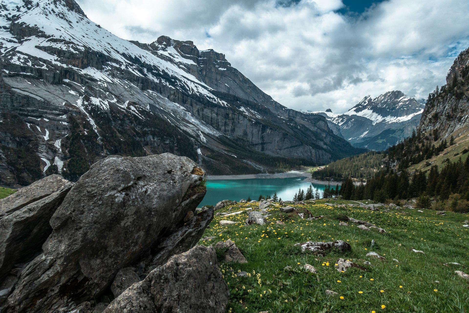 Oeschinensee lake and snowy Swiss Alps